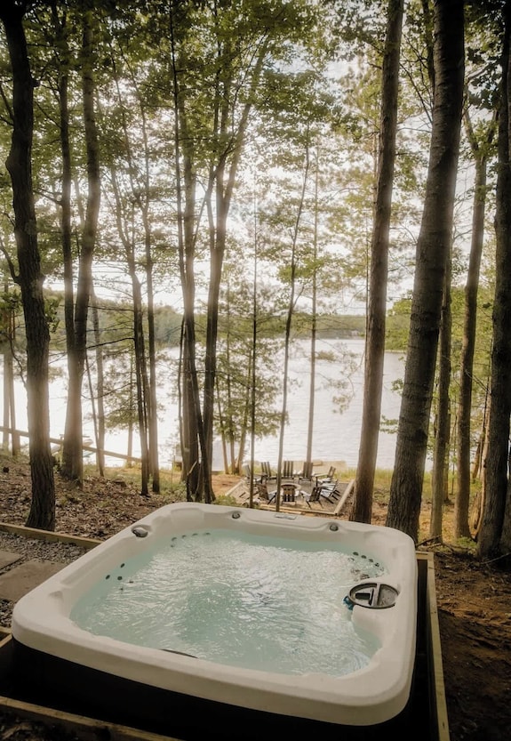 Warm outdoor hot tub scene for a Shoal Lake stay